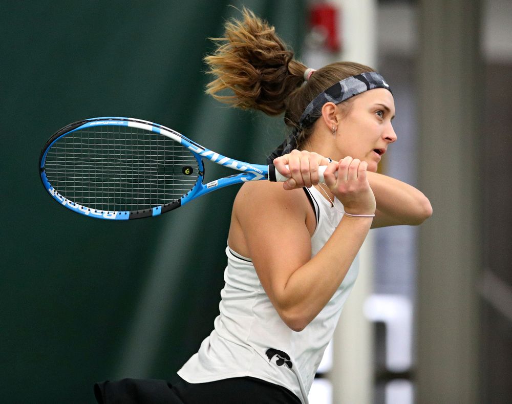 Iowa’s Ashleigh Jacobs returns a shot during her singles match at the Hawkeye Tennis and Recreation Complex in Iowa City on Sunday, February 16, 2020. (Stephen Mally/hawkeyesports.com)