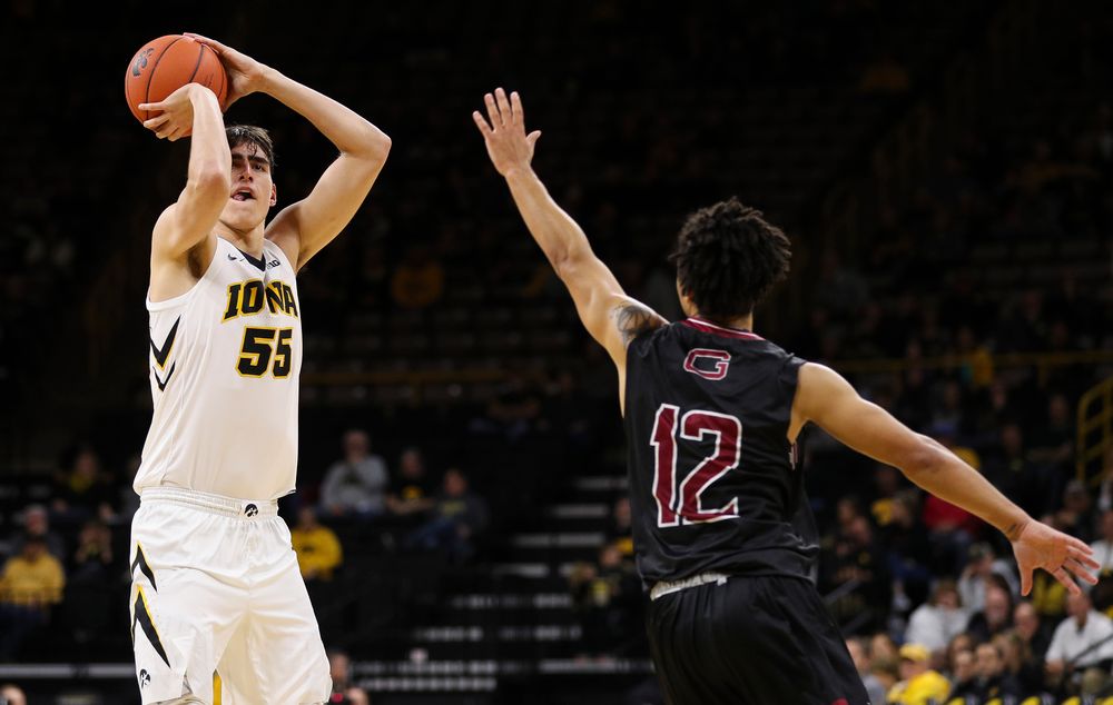 Iowa Hawkeyes forward Luka Garza (55) puts up a 3-pointer during a game against Guilford College at Carver-Hawkeye Arena on November 4, 2018. (Tork Mason/hawkeyesports.com)
