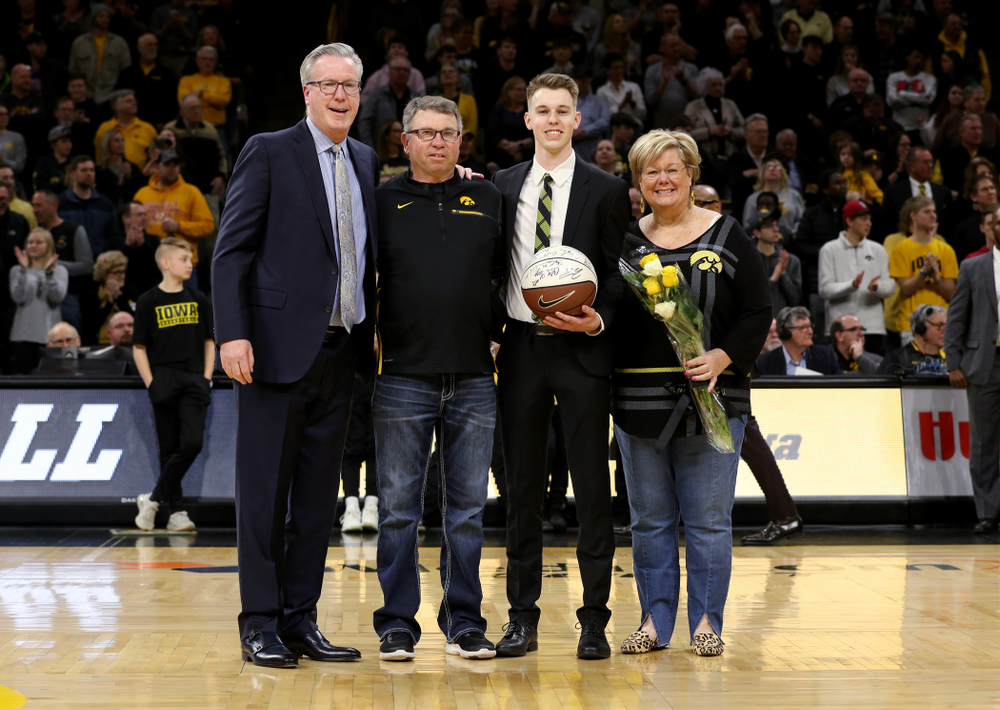 Senior Student Manager Jarrett Knepper and his family during senior night festivities before their game against the Purdue Boilermakers Tuesday, March 3, 2020 at Carver-Hawkeye Arena. (Brian Ray/hawkeyesports.com)