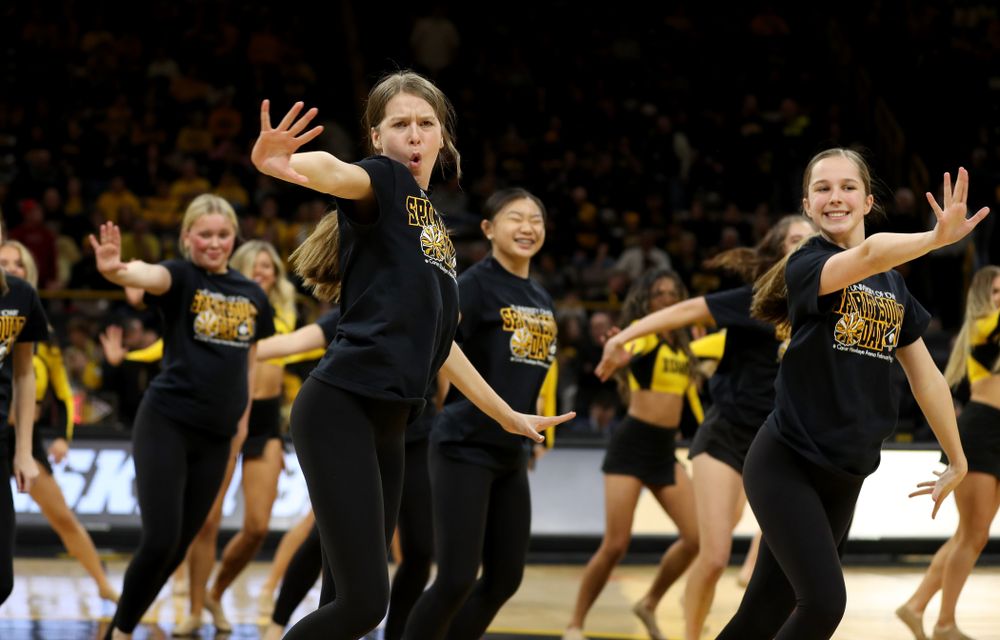 The Iowa Spirit Squad performs with participants in Spirit Squad Day at halftime of the Iowa Hawkeyes game against the Nebraska Cornhuskers Saturday, February 8, 2020 at Carver-Hawkeye Arena. (Brian Ray/hawkeyesports.com)