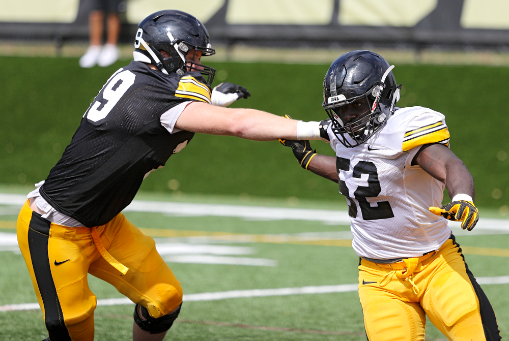 Iowa Hawkeyes offensive lineman Jack Plumb (79) runs a drill with linebacker Amani Jones (52) during Fall Camp Practice No. 11 at the Hansen Football Performance Center in Iowa City on Wednesday, Aug 14, 2019. (Stephen Mally/hawkeyesports.com)