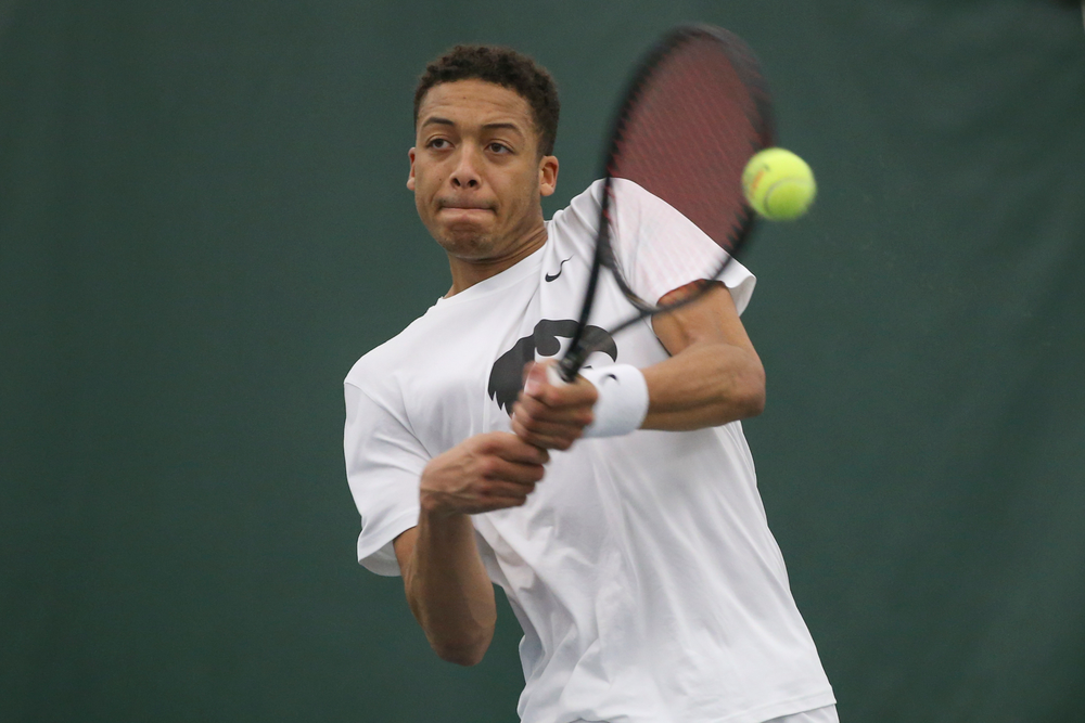 Iowa’s Oliver Okonkwo returns a hit during the Iowa men’s tennis meet vs Nebraska on Sunday, March 1, 2020 at the Hawkeye Tennis and Recreation Complex. (Lily Smith/hawkeyesports.com)