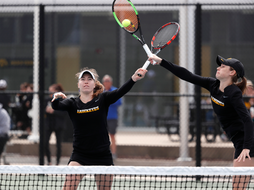 Elise Van Heuvelen and Anastasia Reimchen play a doubles match against the Wisconsin Badgers Sunday, April 22, 2018 at the Hawkeye Tennis and Recreation Center. (Brian Ray/hawkeyesports.com)