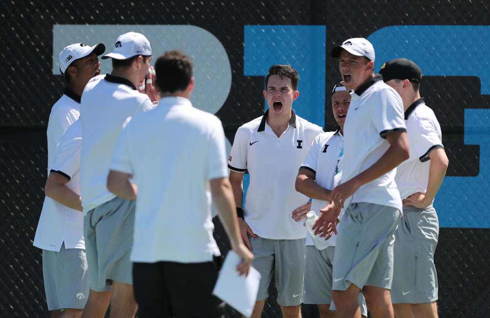 The Iowa Hawkeyes celebrate after winning the doubles point against the Michigan Wolverines Sunday, April 21, 2019 at the Hawkeye Tennis and Recreation Complex. (Brian Ray/hawkeyesports.com)