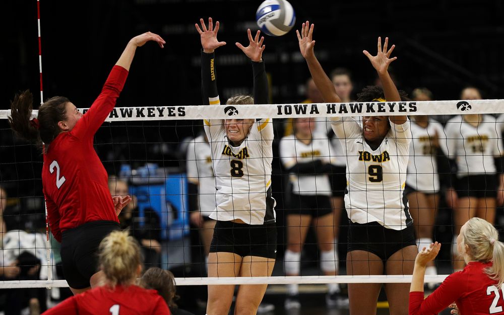 Iowa Hawkeyes right side hitter Reghan Coyle (8) and Iowa Hawkeyes middle blocker Amiya Jones (9) go up for a block during a match against Nebraska at Carver-Hawkeye Arena on November 7, 2018. (Tork Mason/hawkeyesports.com)
