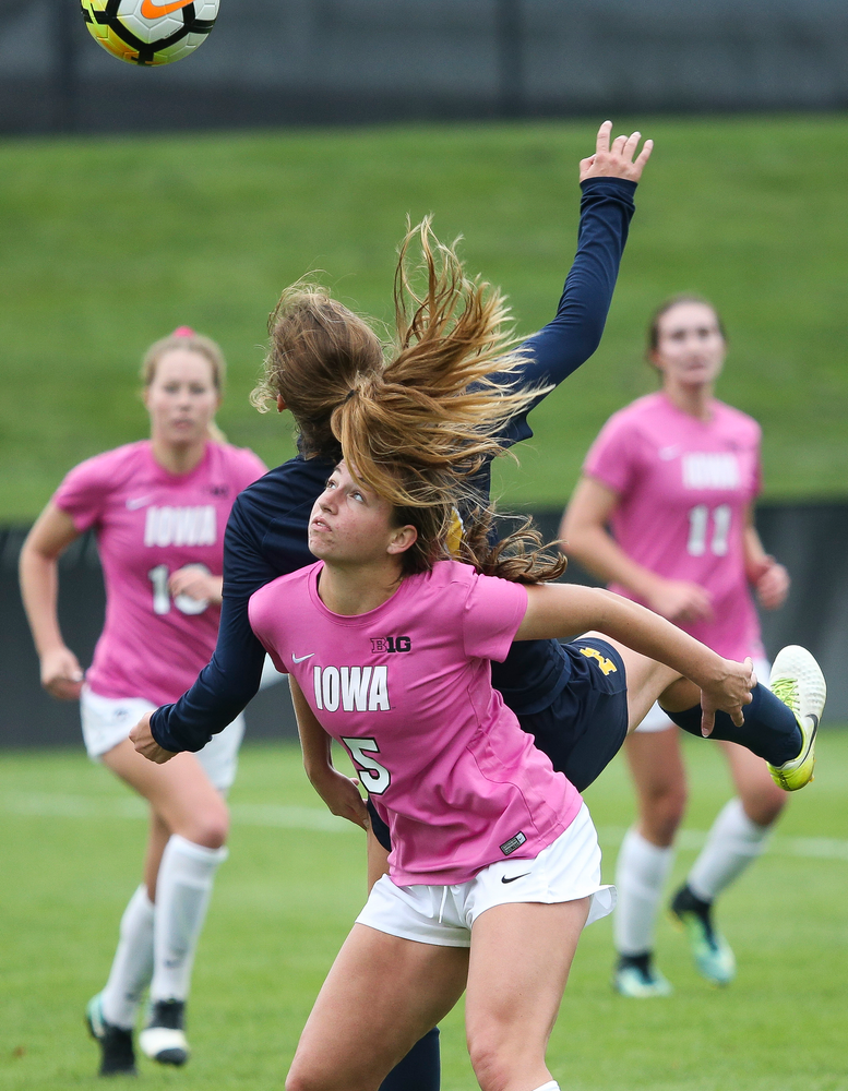Iowa Hawkeyes defender Riley Whitaker (5) heads the ball during a game against Michigan at the Iowa Soccer Complex on October 14, 2018. (Tork Mason/hawkeyesports.com)