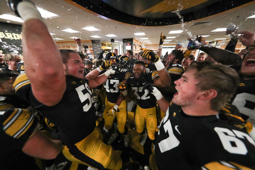 The Iowa Hawkeyes celebrate in the locker room following their game against the Nebraska Cornhuskers Friday, November 23, 2018 at Kinnick Stadium. (Brian Ray/hawkeyesports.com)