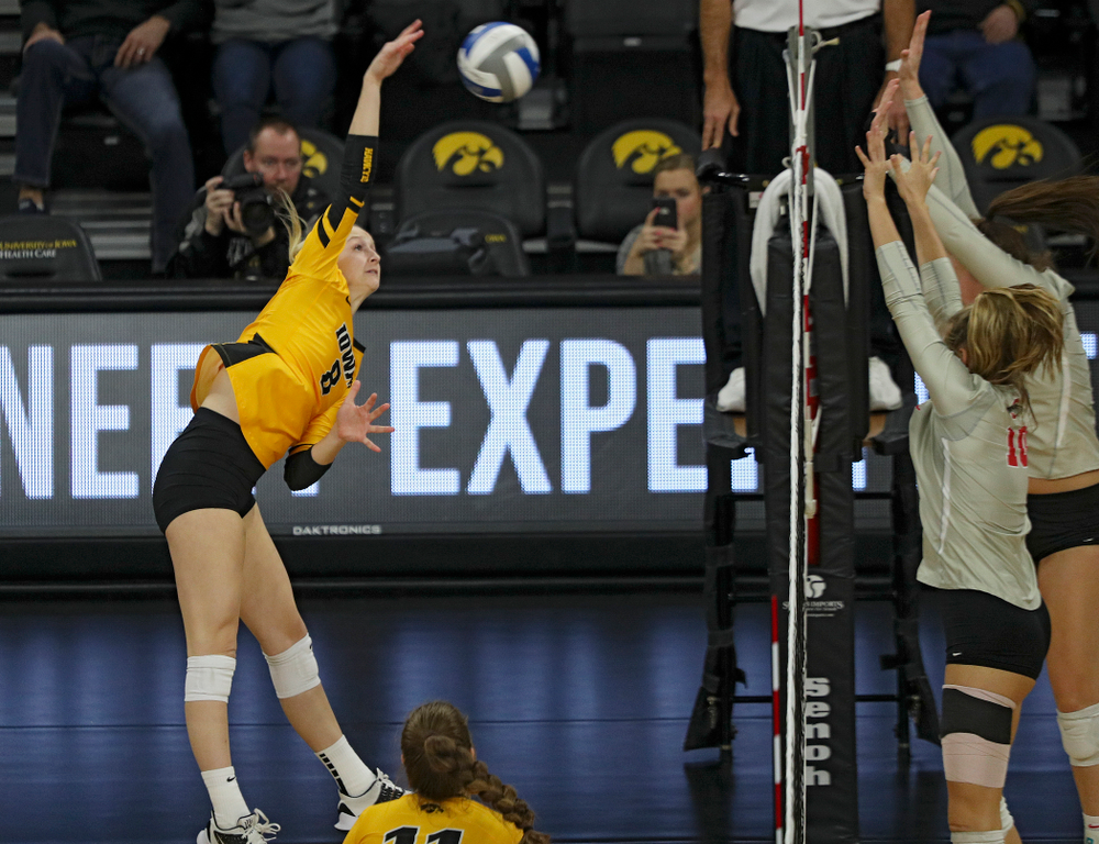 Iowa’s Kyndra Hansen (8) gets a kill during the third set of their match at Carver-Hawkeye Arena in Iowa City on Friday, Nov 29, 2019. (Stephen Mally/hawkeyesports.com)