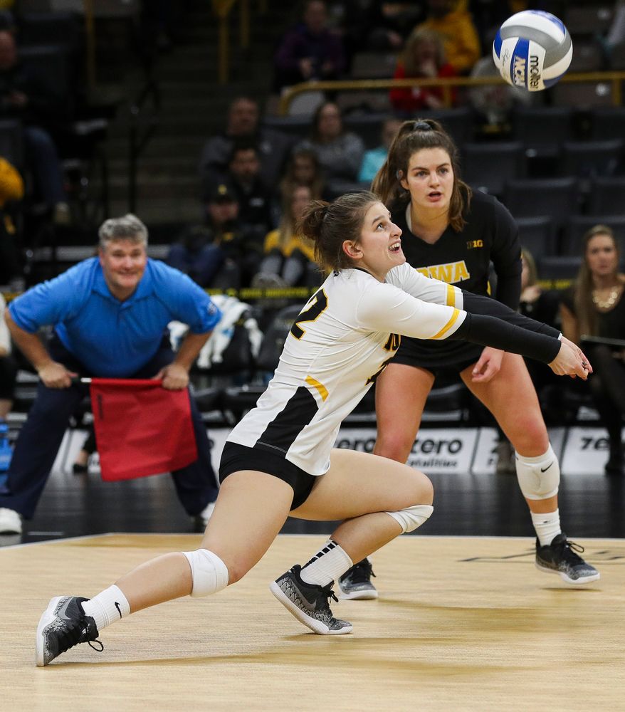 Iowa Hawkeyes defensive specialist Emily Bushman (12) digs the ball during a match against Maryland at Carver-Hawkeye Arena on November 23, 2018. (Tork Mason/hawkeyesports.com)