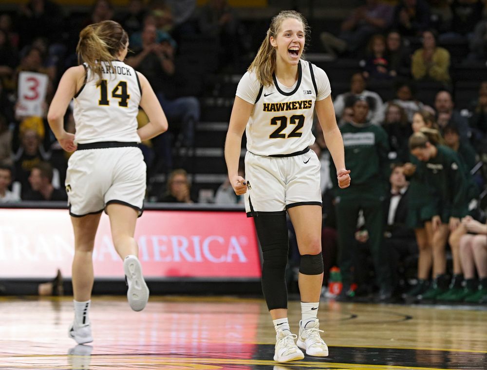 Iowa Hawkeyes guard Kathleen Doyle (22) is pumped up after guard Mckenna Warnock (14) made a 3-pointer during the fourth quarter of their game at Carver-Hawkeye Arena in Iowa City on Sunday, January 26, 2020. (Stephen Mally/hawkeyesports.com)
