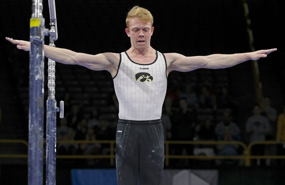Iowa's Nick Merryman competes in the parallel bars during the second day of the Big Ten Men's Gymnastics Championships at Carver-Hawkeye Arena in Iowa City on Saturday, Apr. 6, 2019. (Stephen Mally/hawkeyesports.com)