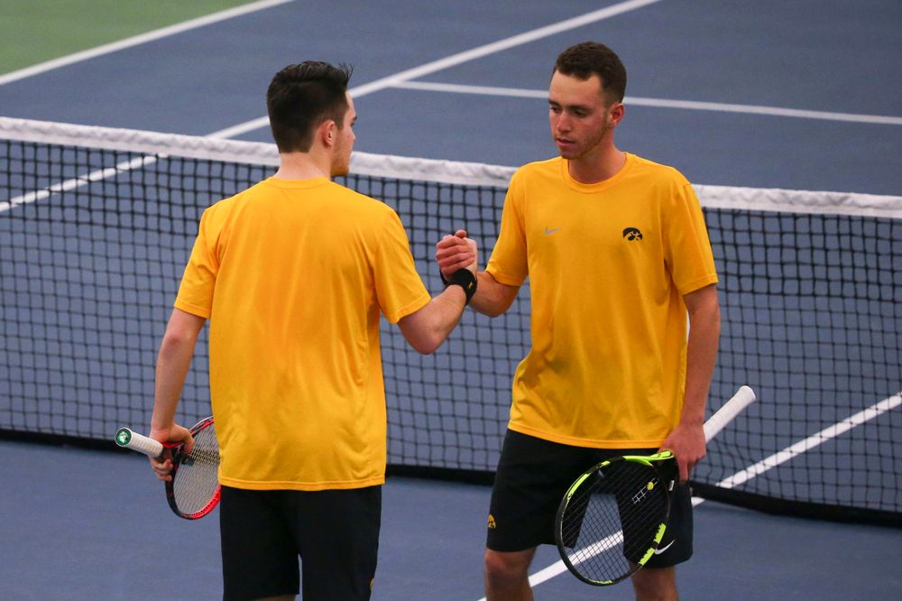 Iowa's Kareem Allaf (right) and Jonas Larsen (left) at a tennis match vs Drake Friday, March 8, 2019 at the Hawkeye Tennis and Recreation Complex. (Lily Smith/hawkeyesports.com)