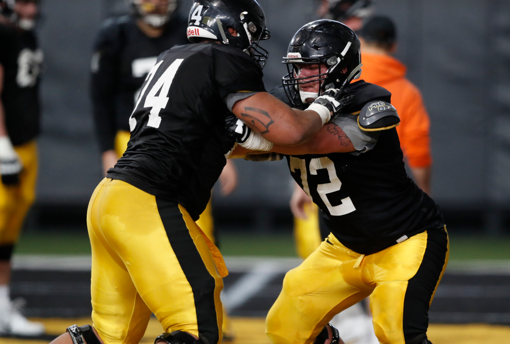 Iowa Hawkeyes offensive lineman Coy Kirkpatrick (72) and offensive lineman Tristan Wirfs (74) during spring practice Thursday, March 29, 2018 at the Hansen Football Performance Center. (Brian Ray/hawkeyesports.com)