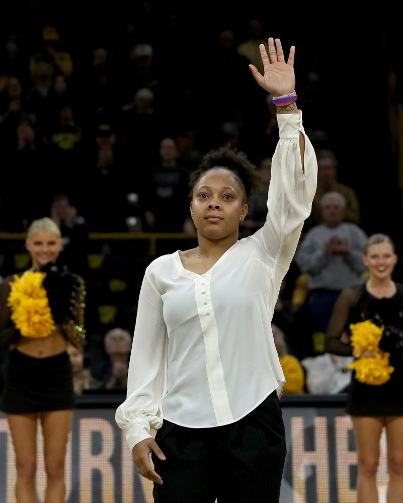 Former Hawkeye and Clemson graduate assistant Tania Davis waves to the fans after being introduced before their game Wednesday, December 4, 2019 at Carver-Hawkeye Arena. (Brian Ray/hawkeyesports.com)