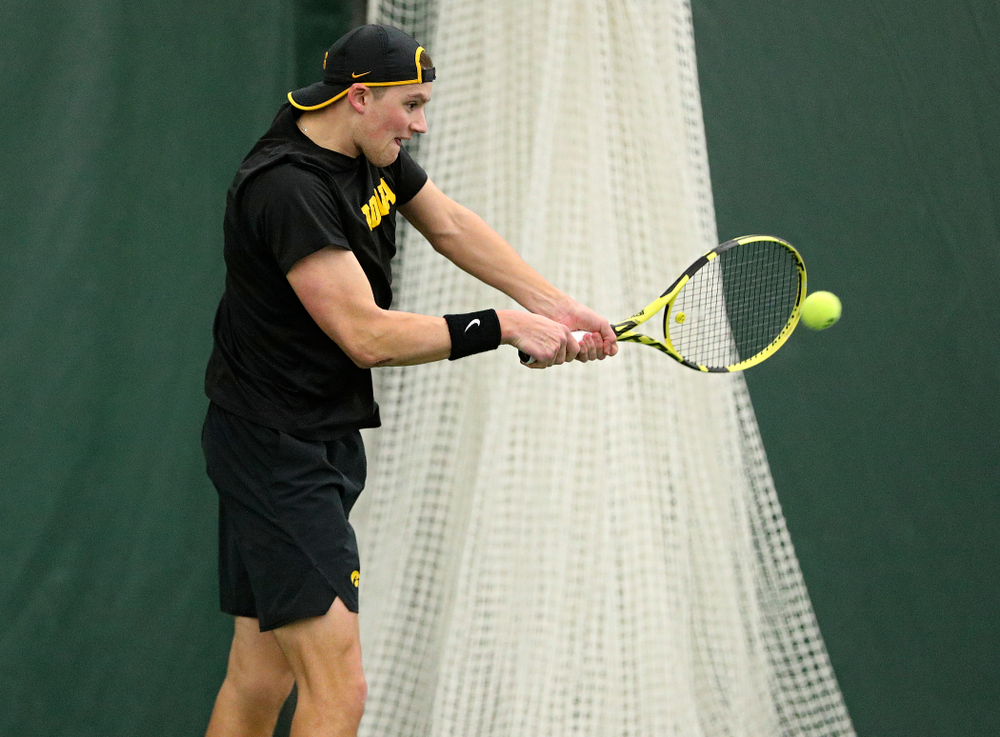 Iowa’s Joe Tyler returns a shot during his singles match at the Hawkeye Tennis and Recreation Complex in Iowa City on Friday, February 14, 2020. (Stephen Mally/hawkeyesports.com)