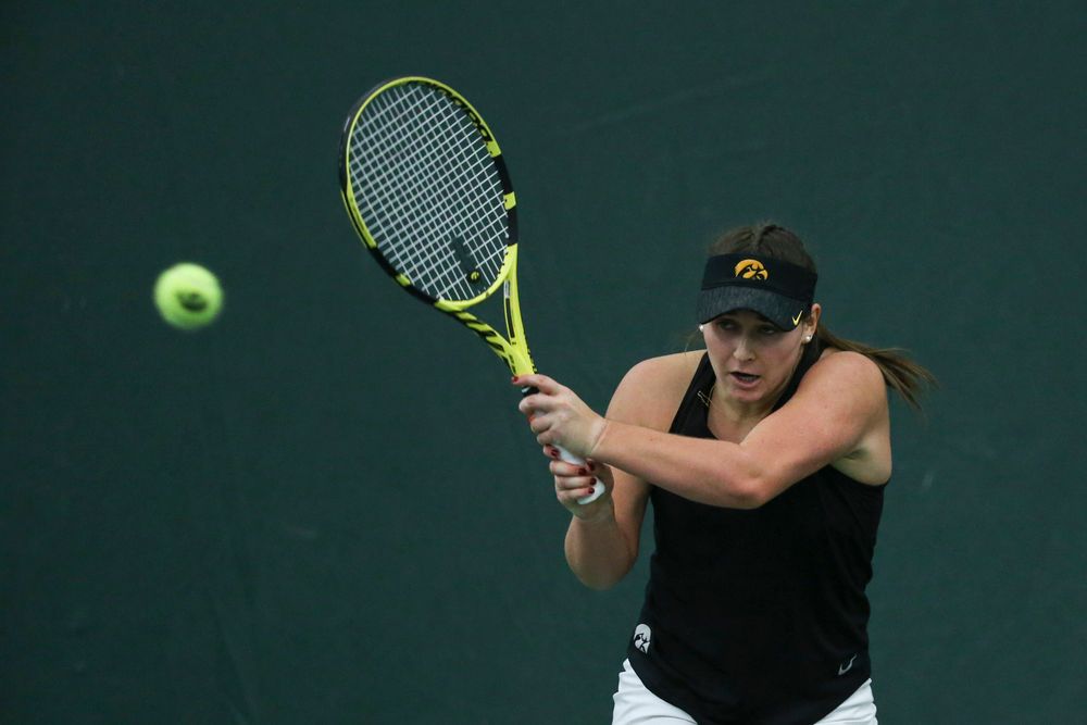 Iowa’s Danielle Bauers returns a hit during the Iowa women’s tennis meet vs DePaul on Friday, February 21, 2020 at the Hawkeye Tennis and Recreation Complex. (Lily Smith/hawkeyesports.com)