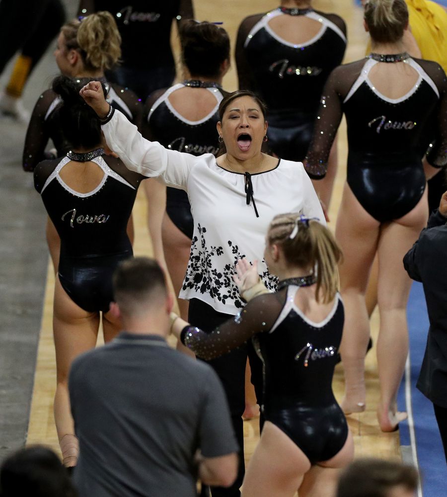 Iowa’s Head Coach Larissa Libby hugs Lauren Guerin after her performance on the vault against Michigan State Saturday, February 1, 2020 at Carver-Hawkeye Arena. (Brian Ray/hawkeyesports.com)