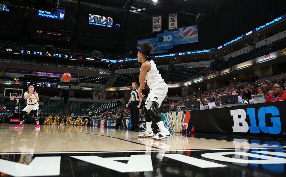 Iowa Hawkeyes guard Tania Davis (11) dishes off a pass to guard Makenzie Meyer (3) against the Indiana Hoosiers in the quarterfinals of the Big Ten Tournament Friday, March 8, 2019 at Bankers Life Fieldhouse in Indianapolis, Ind. (Brian Ray/hawkeyesports.com)