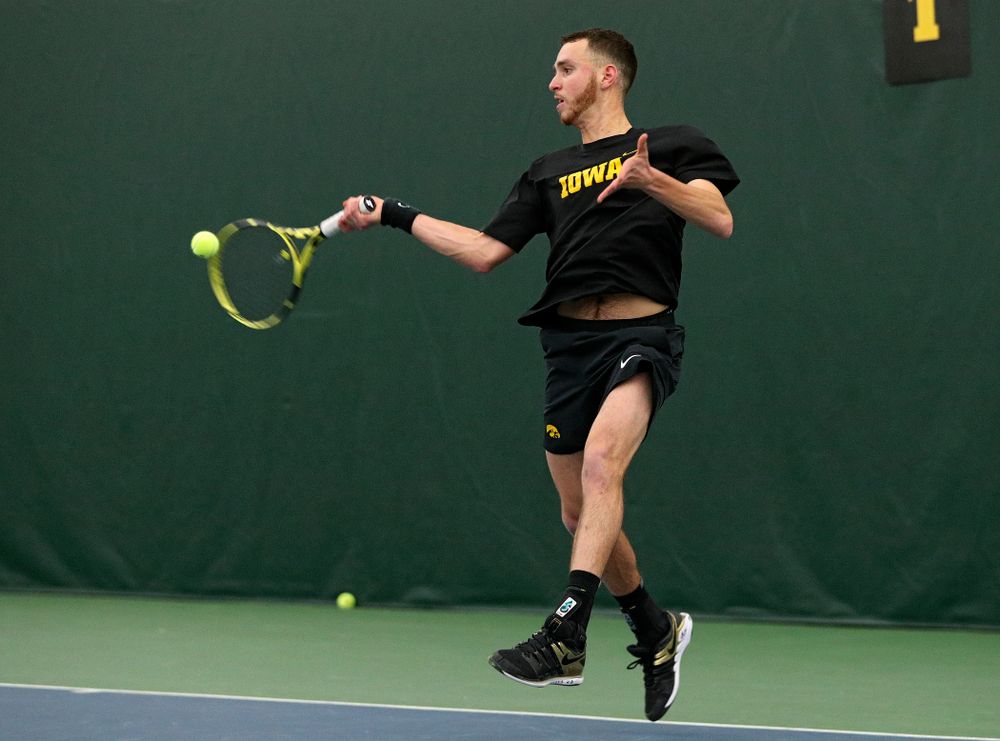 Iowa’s Kareem Allaf returns a shot during his singles match at the Hawkeye Tennis and Recreation Complex in Iowa City on Friday, March 6, 2020. (Stephen Mally/hawkeyesports.com)