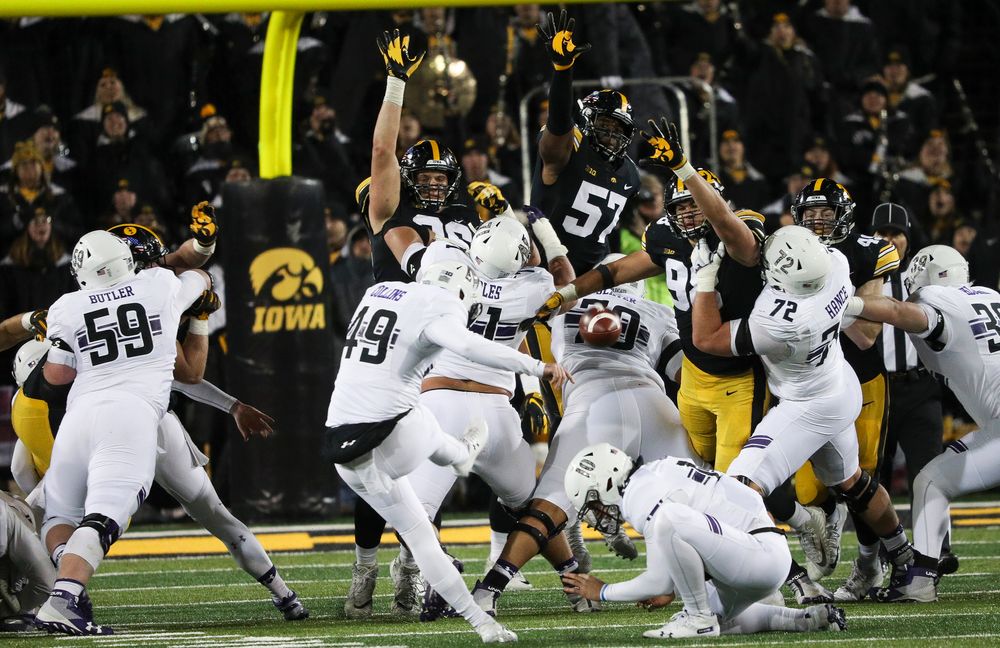 Iowa Hawkeyes defensive lineman Matt Nelson (96), Iowa Hawkeyes defensive end Chauncey Golston (57) and Iowa Hawkeyes defensive end Anthony Nelson (98) try to block a field goal attempt during a game against Northwestern at Kinnick Stadium on November 10, 2018. (Tork Mason/hawkeyesports.com)