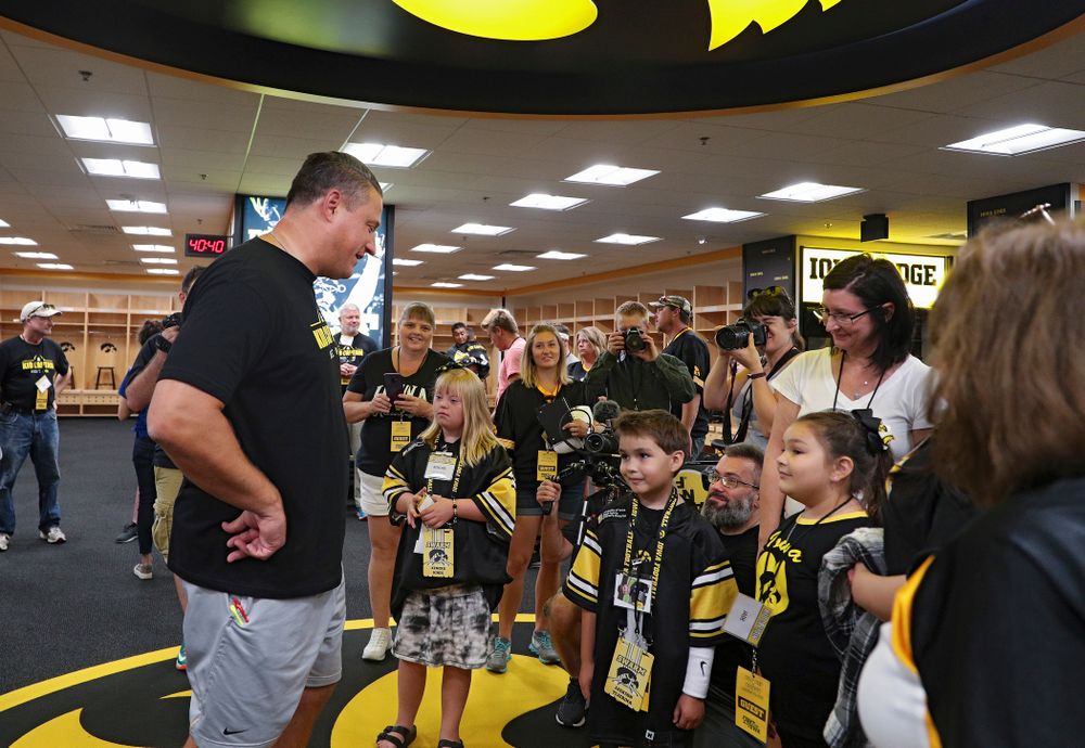 Iowa Hawkeyes offensive coordinator Brian Ferentz talks with Kid Captains Kendra Hines and Jackson Tijerina during Kids Day at Kinnick Stadium in Iowa City on Saturday, Aug 10, 2019. (Stephen Mally/hawkeyesports.com)