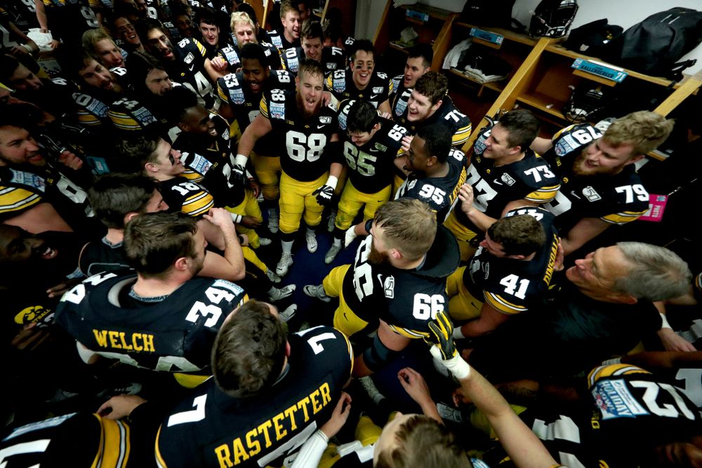 The Iowa Hawkeyes do the Hokey Pokey in the locker room to honor the late Hayden Fry following their win against USC in the Holiday Bowl Saturday, December 28, 2019 at San Diego Community Credit Union Stadium. (Brian Ray/hawkeyesports.com)