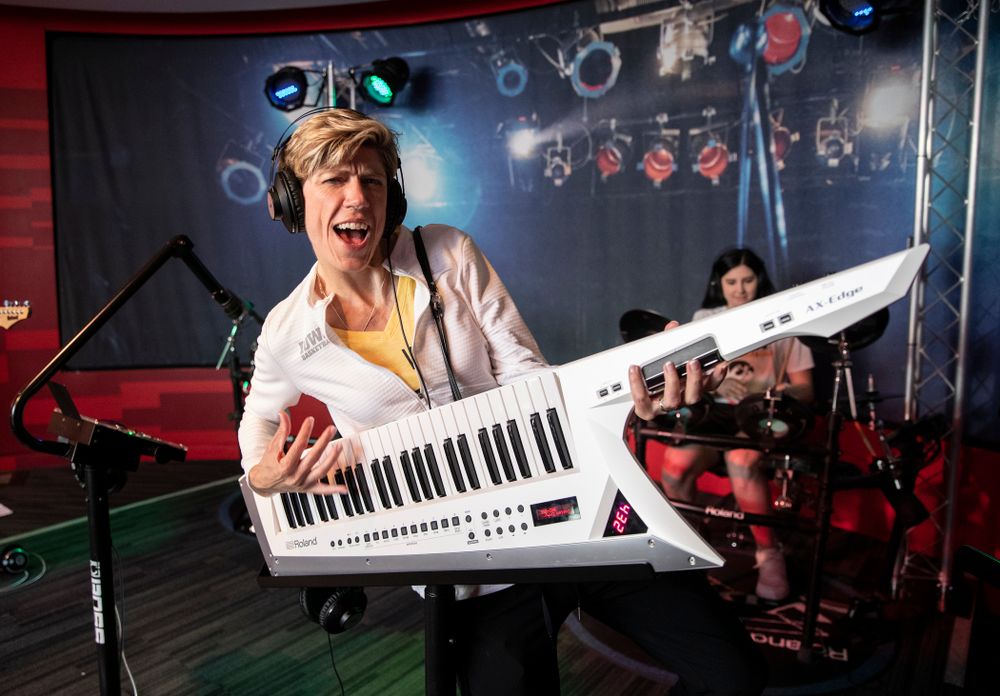 Iowa Hawkeyes associate head coach Jan Jensen plays the keytar in a exhibit at the Grammy Museum Friday, April 12, 2019 in downtown LA. (Brian Ray/hawkeyesports.com)