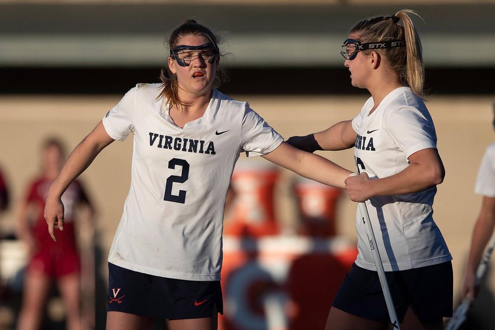 STANFORD, California - FEBRUARY 14: Virginia Cavaliers midfield Sammy Mueller (2) is congratulated by midfield Ashlyn McGovern (16) after scoring a goal against the Stanford Cardinal during the second half at Cagan Stadium on February 14, 2020 in Stanford, California. The Virginia Cavaliers defeated the Stanford Cardinal 12-11. (Photo by Jason O. Watson)