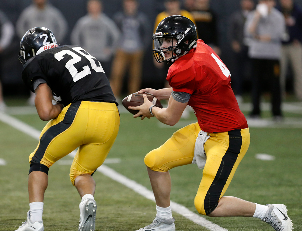 Toren Young, Nate Stanley -- University of Iowa spring football practice No. 6 on March 31, 2018, in Iowa City, Iowa. (Darren Miller/hawkeyesports.com)