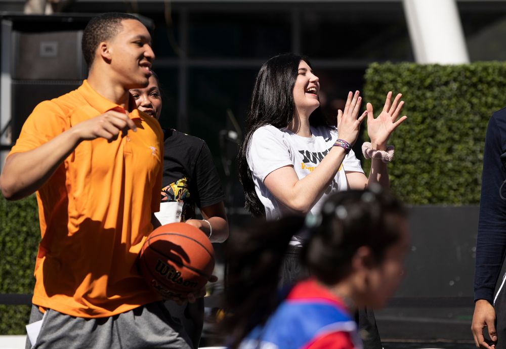 Iowa Hawkeyes forward Megan Gustafson (10) cheers on the athletes during a Special Olympics Event Friday, April 12, 2019 in the XBOX Plaza at LA Live. (Brian Ray/hawkeyesports.com)