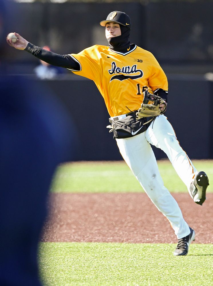 Iowa Hawkeyes shortstop Tanner Wetrich (16) throw to first for the final out in the ninth inning against Illinois at Duane Banks Field in Iowa City on Sunday, Mar. 31, 2019. (Stephen Mally/hawkeyesports.com)