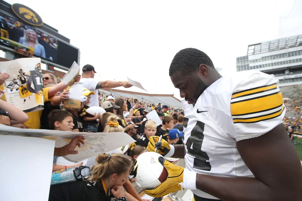 Iowa's Daraun McKinney signs autographs at the Kids Day at Kinnick Stadium on Saturday, August 10, 2019 (Lily Smith/hawkeyesports.com)