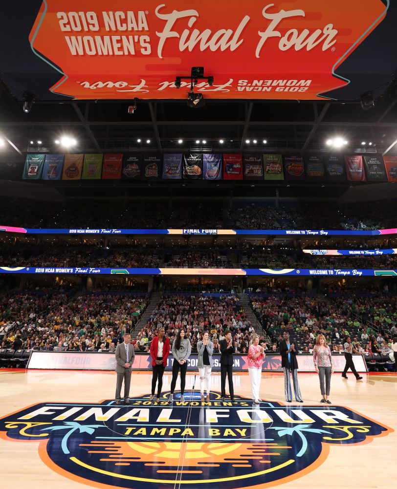 Iowa Hawkeyes forward Megan Gustafson (10) and Iowa State's Bridget Carleton are introduced with Naismith Starting 5 namesakes during a timeout in the second half of the National Semi-Final between Baylor and Oregon Friday, April 5, 2019 at Amalie Arena in Tampa, FL. (Brian Ray/hawkeyesports.com)