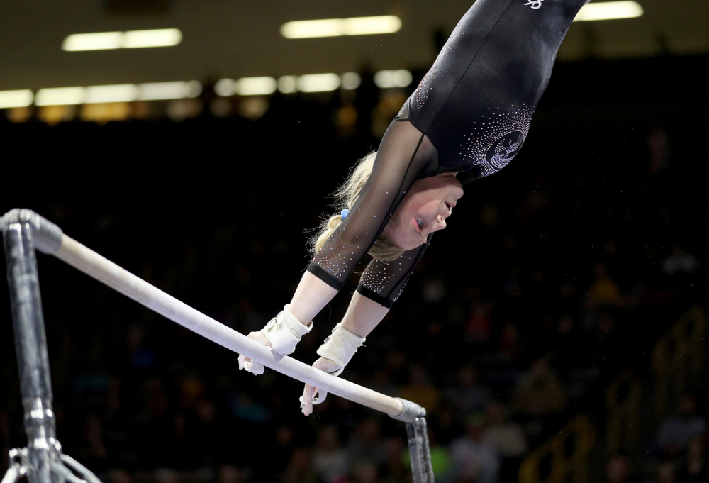 Iowa’s Elinor Rogers competes on the bars against Michigan Friday, February 14, 2020 at Carver-Hawkeye Arena. (Brian Ray/hawkeyesports.com)