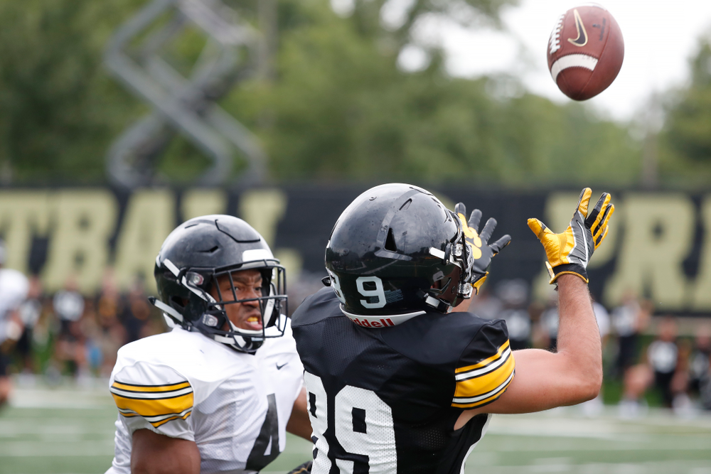 Iowa Hawkeyes wide receiver Nico Ragaini (89) and defensive back Josh Turner (4) during practice No. 4 of Fall Camp Monday, August 6, 2018 at the Hansen Football Performance Center. (Brian Ray/hawkeyesports.com)