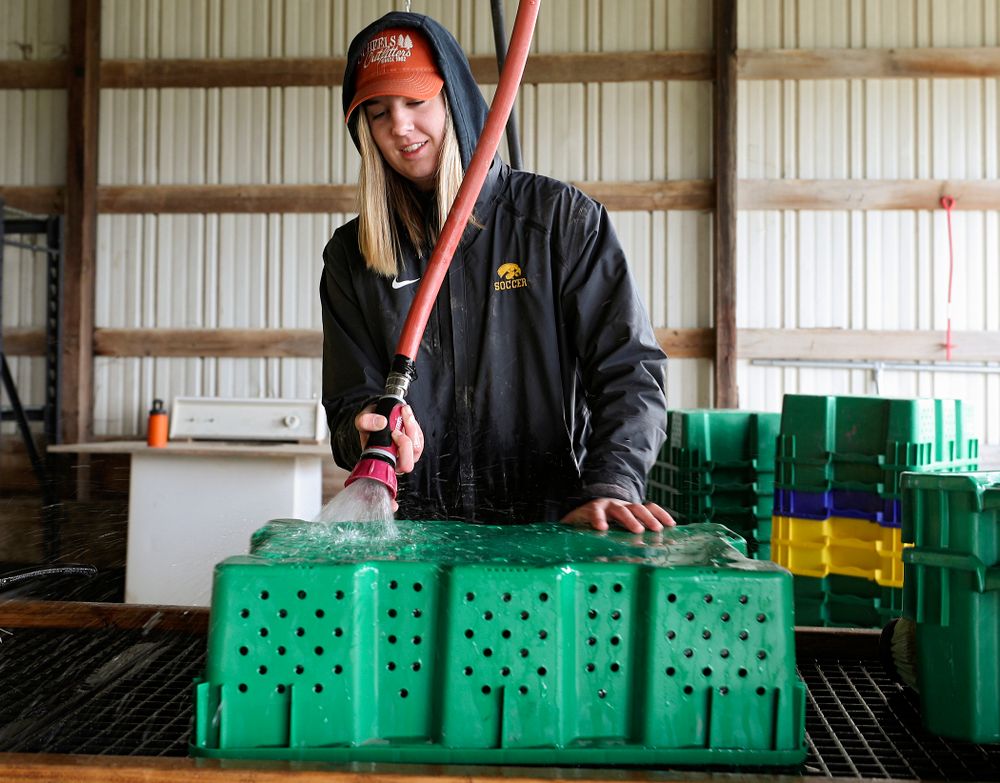 Iowa soccer players wash items for Grow: Johnson County at the Johnson County Historic Poor Farm during the 21st annual ISAAC Hawkeye Day of Caring in Iowa City on Sunday, Apr. 28, 2019. (Stephen Mally/hawkeyesports.com)