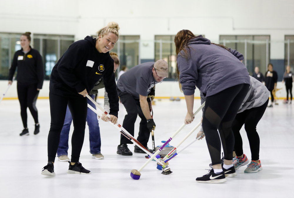 Members of the Iowa Softball team learn the sport of curling as part of a team building event Wednesday, January 10, 2018 at the Cedar Rapids Ice Arena. (Brian Ray/hawkeyesports.com)