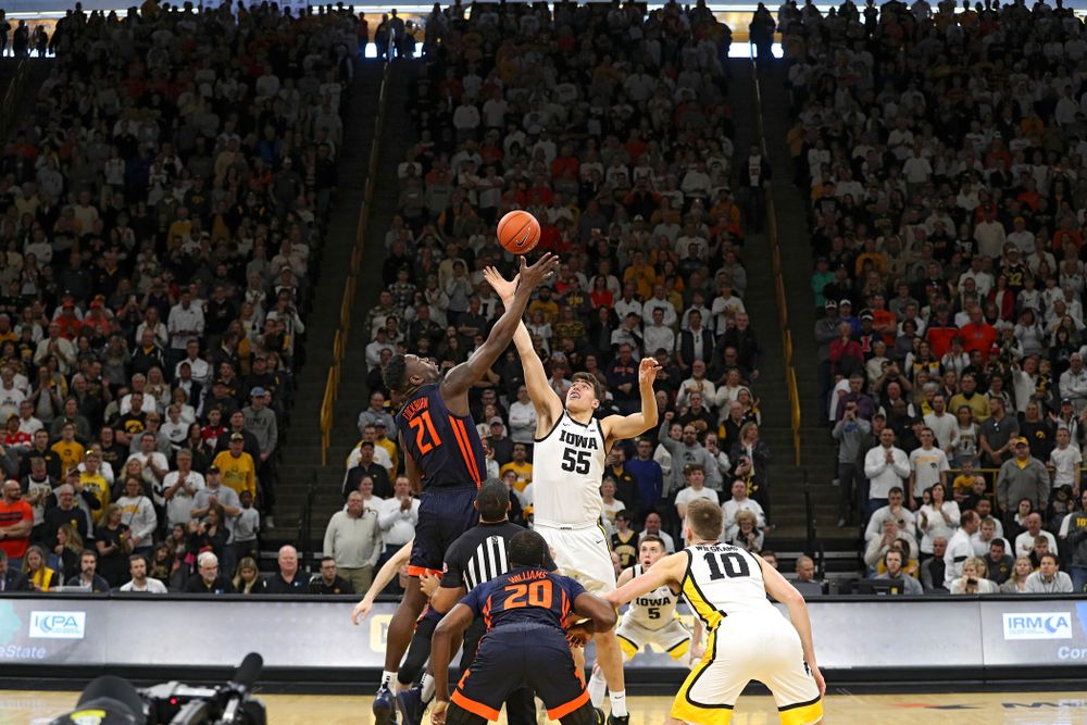 Iowa Hawkeyes center Luka Garza (55) battles for the opening tip off during the first quarter of the game at Carver-Hawkeye Arena in Iowa City on Sunday, February 2, 2020. (Stephen Mally/hawkeyesports.com)