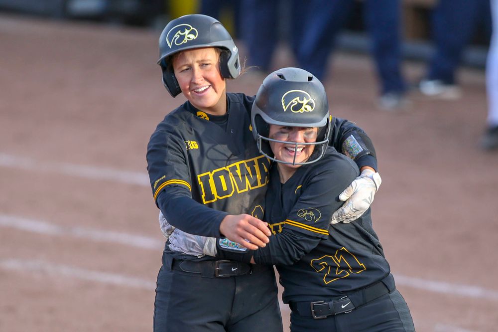 IowaÕs Mallory Kilian (11) and IowaÕs Havyn Monteer (21) at softball vs Illinois game 3 on Saturday, April 13, 2019 at Bob Pearl Field. (Lily Smith/hawkeyesports.com)