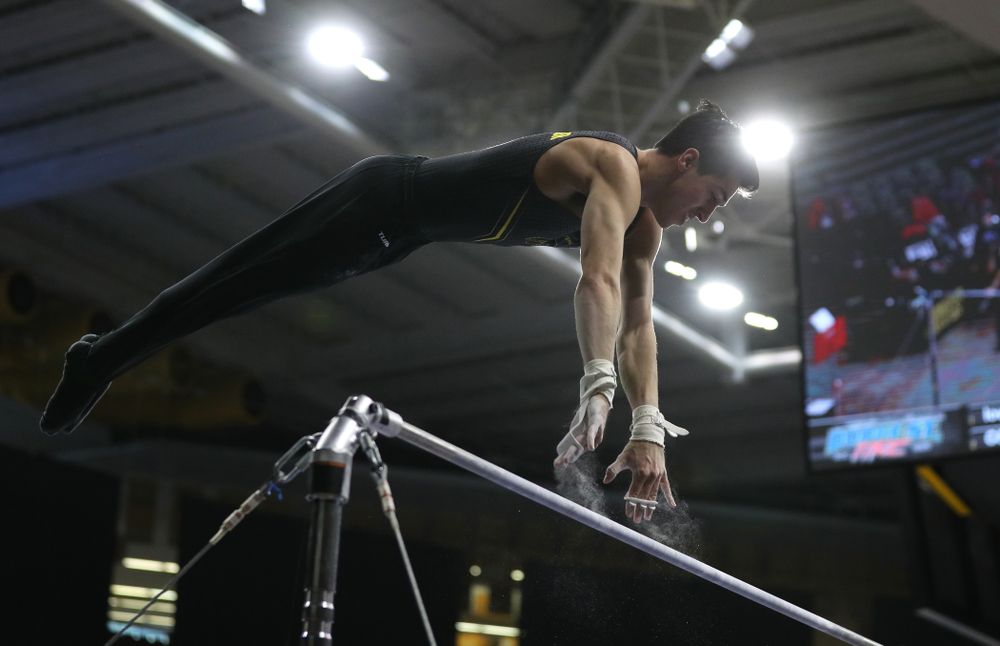 Iowa's Andrew Herrador competes on the high bar against the Ohio State Buckeyes Saturday, March 16, 2019 at Carver-Hawkeye Arena. (Brian Ray/hawkeyesports.com)