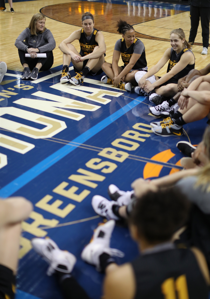 The Iowa Hawkeyes talk in their circle at the end of shoot around before their game against the NC State Wolfpack in the regional semi-final of the 2019 NCAA Women's College Basketball Tournament Saturday, March 30, 2019 at Greensboro Coliseum in Greensboro, NC.(Brian Ray/hawkeyesports.com)