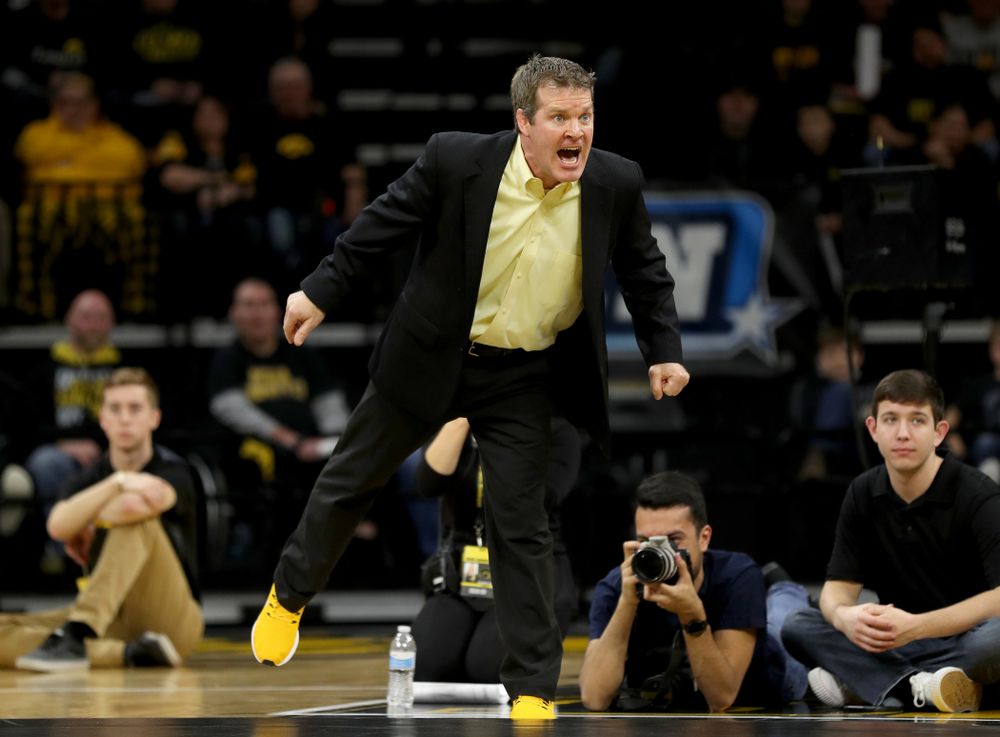 Iowa head coach Tom Brands works the sideline as Michael Kemerer wrestles Ohio State’s Kaleb Romero at 174 pounds Friday, January 24, 2020 at Carver-Hawkeye Arena. Kemerer won the match 7-1. (Brian Ray/hawkeyesports.com)