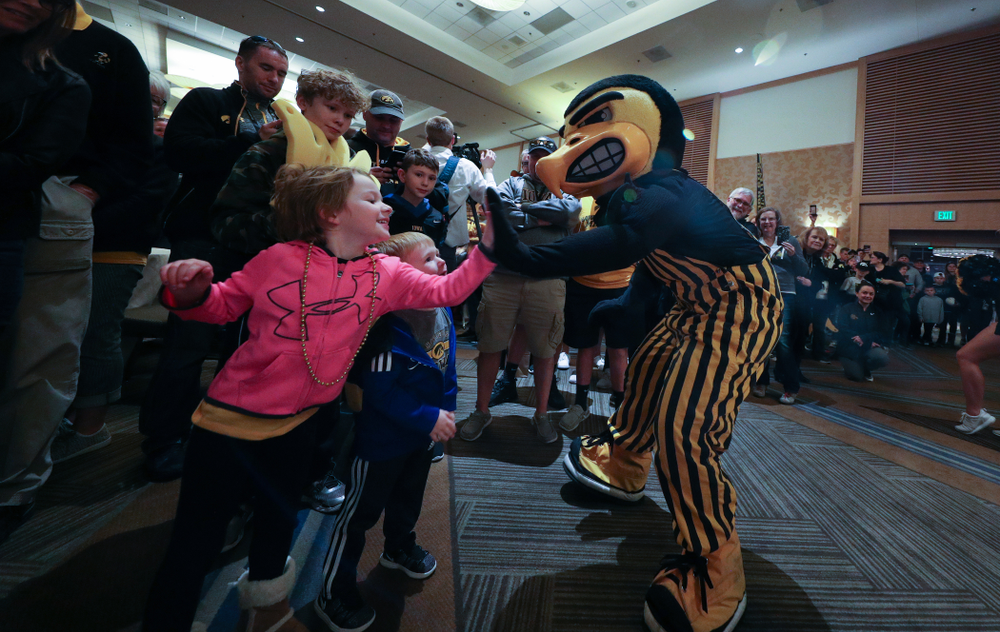 The Hawkeye Marching Band and the Iowa Spirit Squads perform during the Holiday Bowl Hawkeye Huddle Thursday, December 26, 2019 at the Hilton in downtown San Diego. (Brian Ray/hawkeyesports.com)