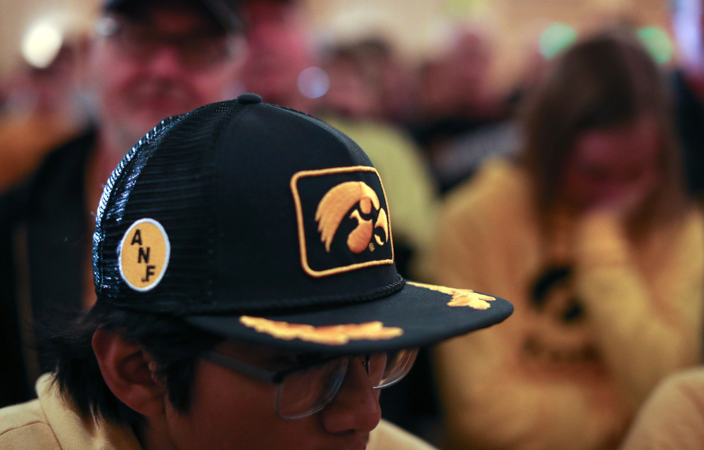 Fans pause for a moment of silence honorary Hayden Fry and Bump Elliott during the Holiday Bowl Hawkeye Huddle Thursday, December 26, 2019 at the Hilton in downtown San Diego. (Brian Ray/hawkeyesports.com)