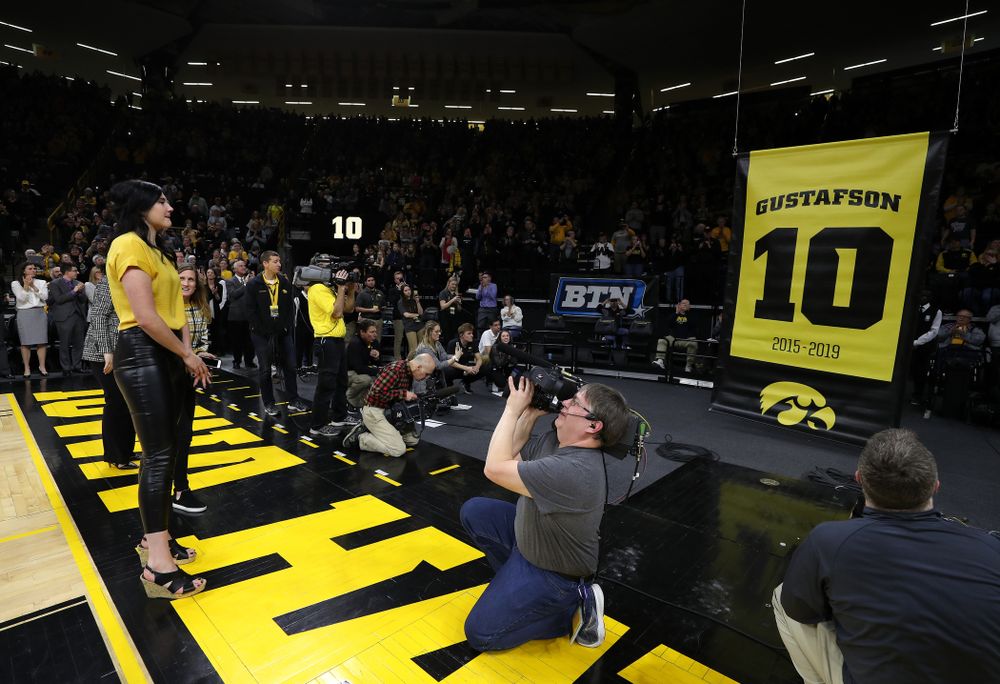 Megan Gustafson stands with her family as her number is raised into the rafters during a jersey retirement ceremony Sunday, January 26, 2020 at Carver-Hawkeye Arena. (Brian Ray/hawkeyesports.com)