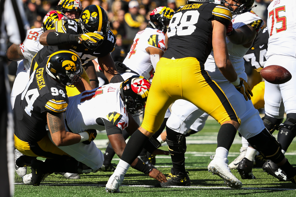 Iowa Hawkeyes defensive end A.J. Epenesa (94) and Iowa Hawkeyes defensive end Chauncey Golston (57) sack the quarterback during a game against Maryland at Kinnick Stadium on October 20, 2018. (Tork Mason/hawkeyesports.com)