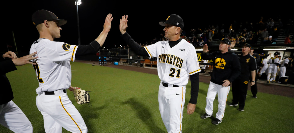 Iowa Hawkeyes pitcher Zach Daniels (2) and head coach Rick Heller against the Michigan Wolverines Friday, April 27, 2018 at Duane Banks Field in Iowa City. (Brian Ray/hawkeyesports.com)