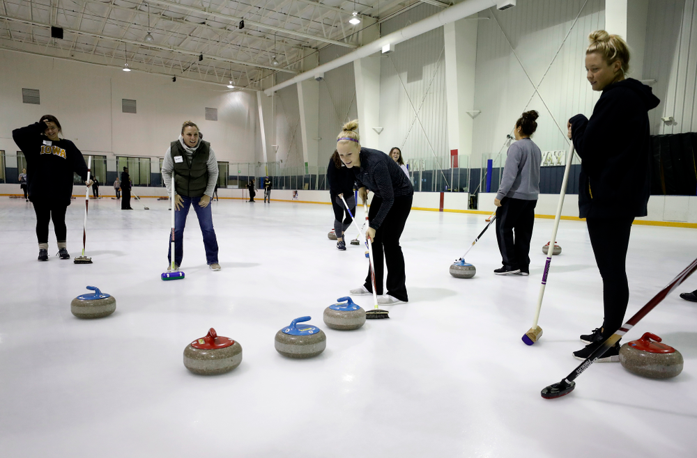 Members of the Iowa Softball team learn the sport of curling as part of a team building event Wednesday, January 10, 2018 at the Cedar Rapids Ice Arena. (Brian Ray/hawkeyesports.com)