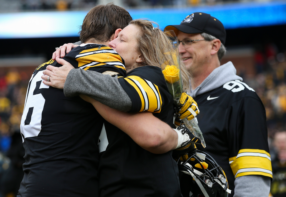 Iowa Hawkeyes defensive lineman Matt Nelson (96) gets a hug from his mother during Senior Day ceremonies before a game against Nebraska at Kinnick Stadium on November 23, 2018. (Tork Mason/hawkeyesports.com)