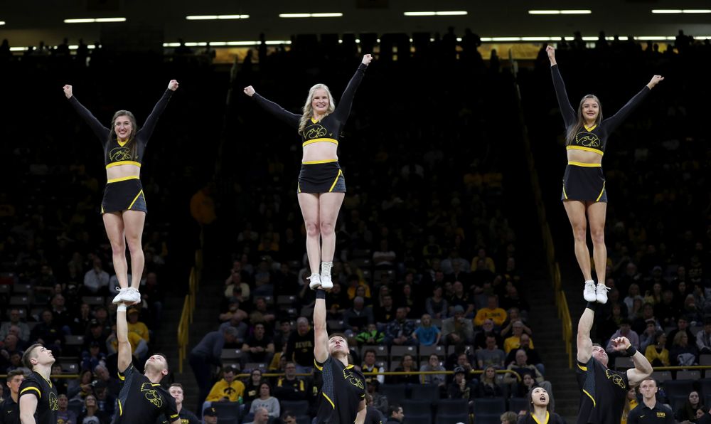 The Iowa Cheerleaders and Dance Team perform on senior night at half-time of the Iowa Hawkeyes game against the Purdue Boilermakers Tuesday, March 3, 2020 at Carver-Hawkeye Arena. (Brian Ray/hawkeyesports.com)